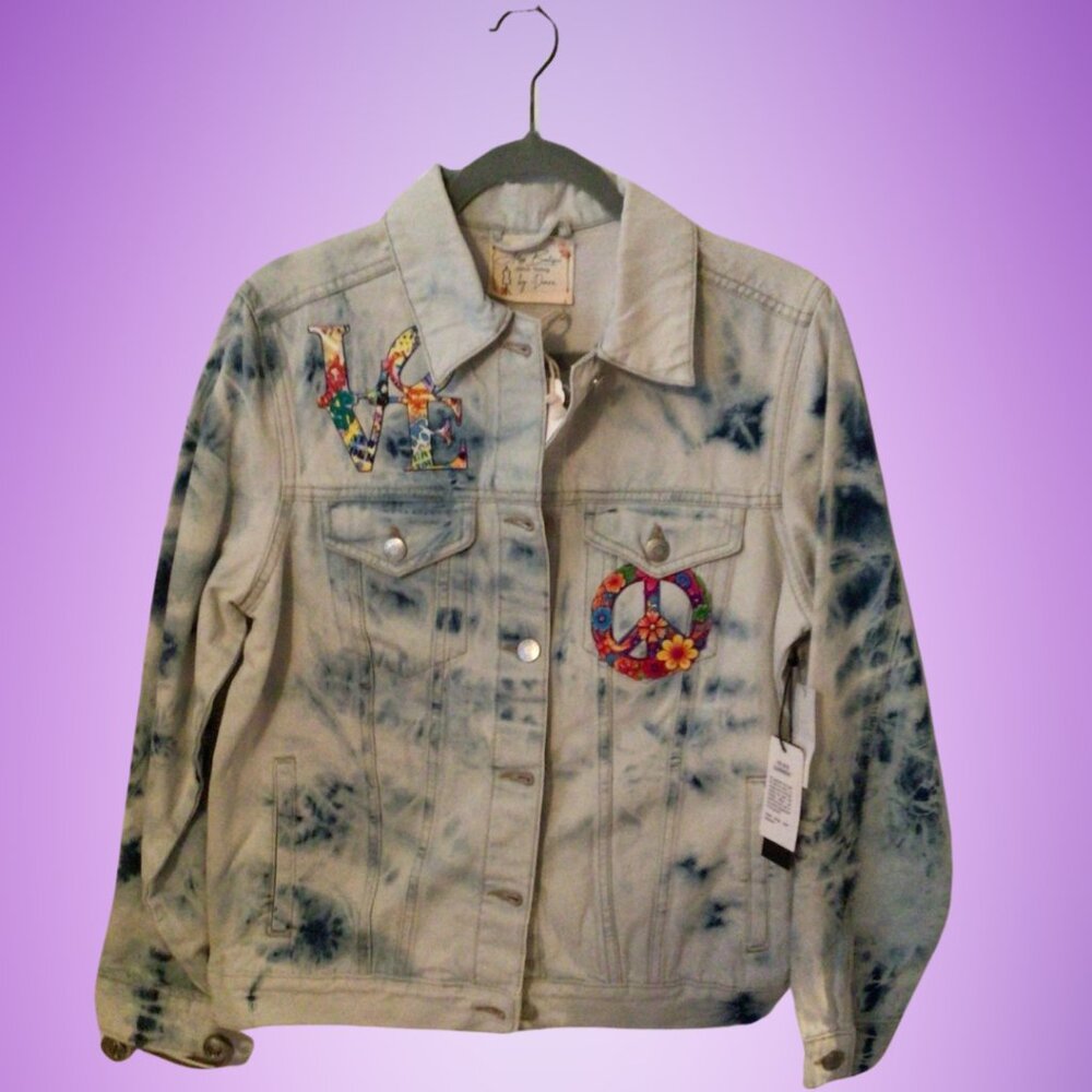 Jean jacket is brand new with tags.  Size Medium, ladies. Armpit to armpit is 21